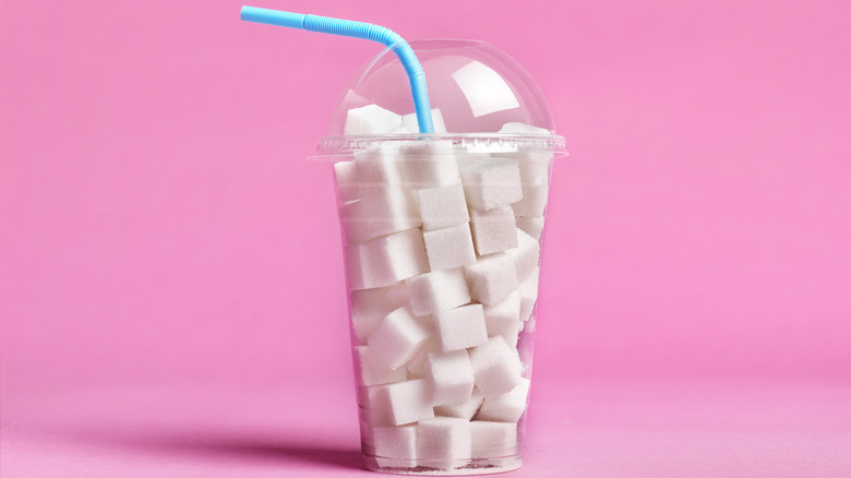 drink cup filled with sugar cubes