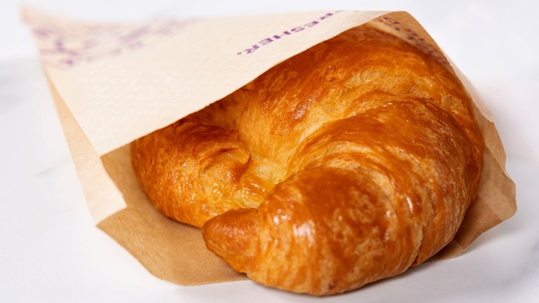 Croissant from The Coffee Bean in brown paper