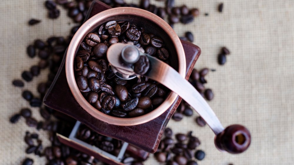 Coffee beans and grinder