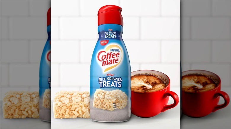 Coffee Mate creamer next to a red cup