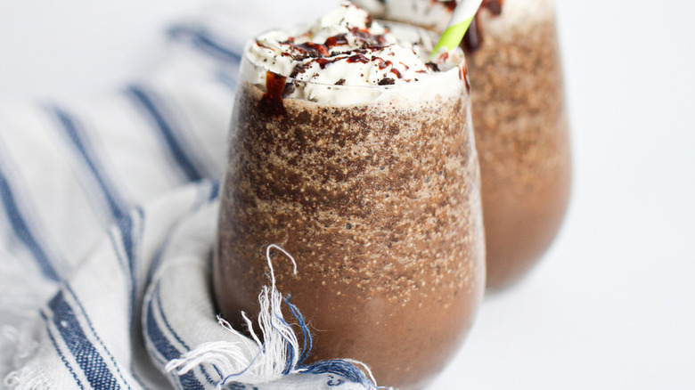 A glass with a frozen cookie coffee frappuccino