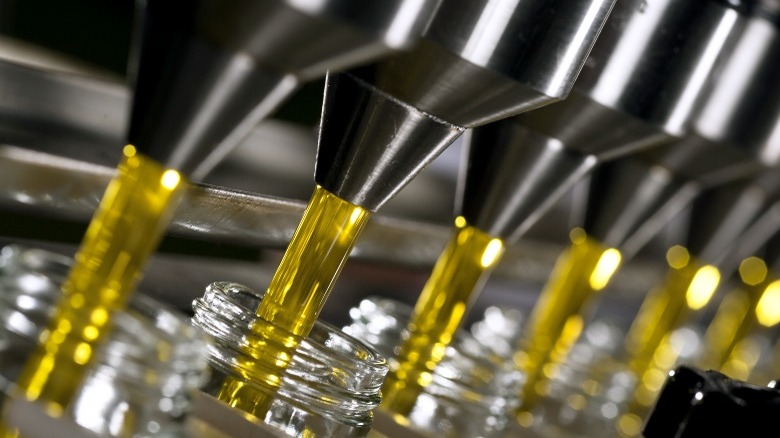 Olive oil being poured from spouts