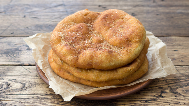 A stack of frybread on a plate.