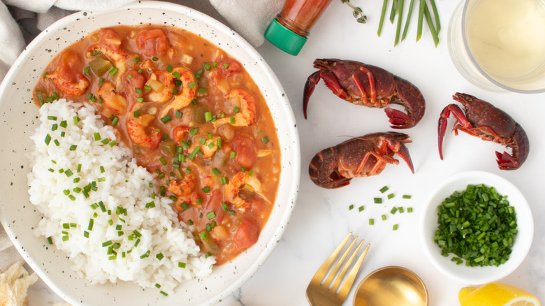 Etouffee in bowl next to crawfish