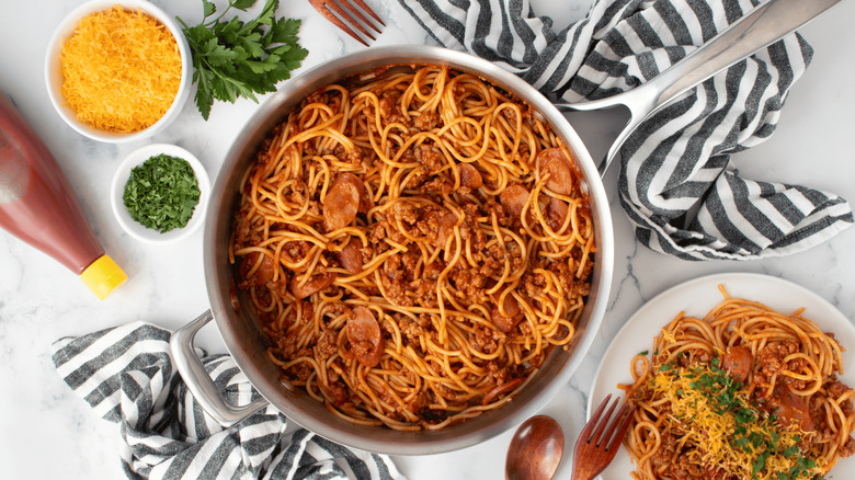 Filipino spaghetti with hot dogs on table