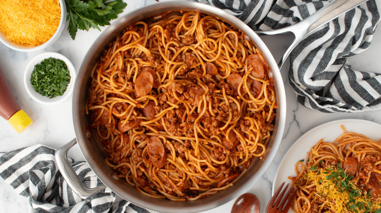 Plate of Filipino spaghetti with hot dogs and pork