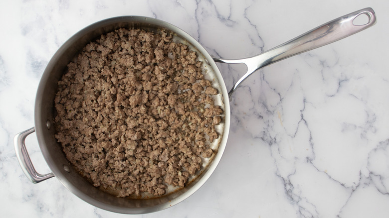 Cooked ground pork in skillet