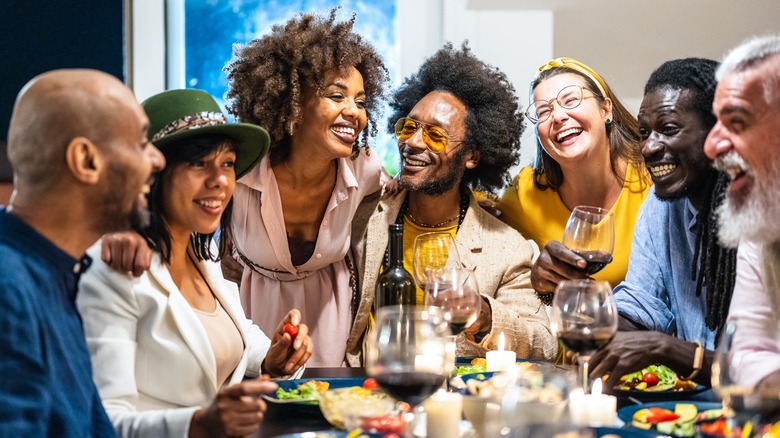 happy people at dinner party