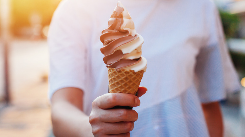 child holding frozen custard cone