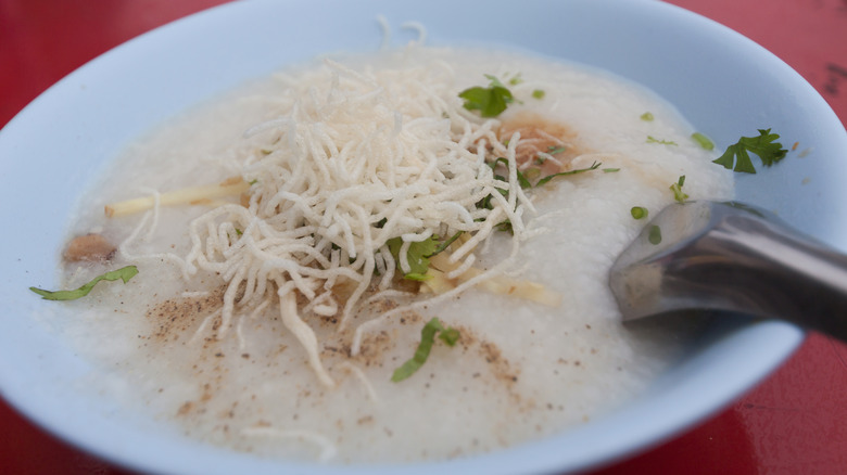 Cantonese jook in a white bowl