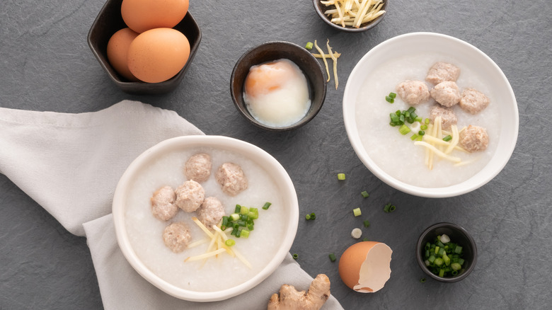 Two white bowls of congee 