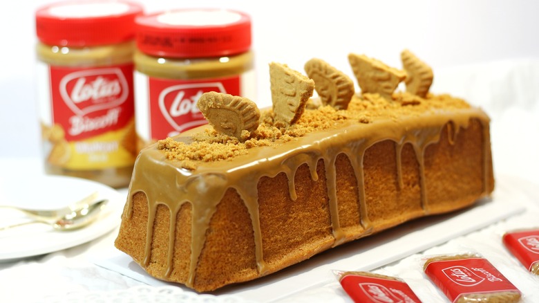 cookie butter cake with biscoff jars in background