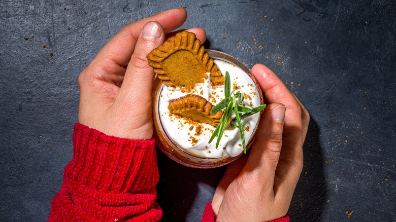 hands holding Biscoff hot chocolate