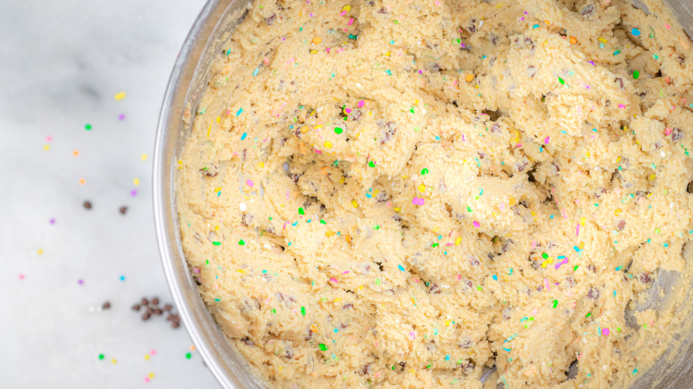 cookie dough in pan for a cookie cake recipe