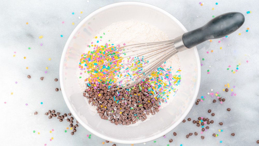 mixing dry ingredients for your cookie cake recipe