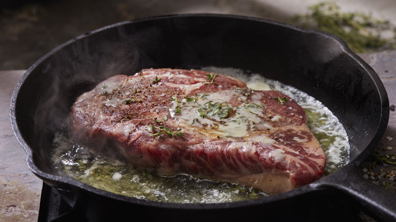 Beef searing in skillet