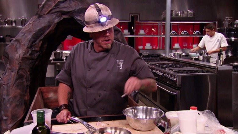 A contestant on Cutthroat Kitchen gets down to business. 