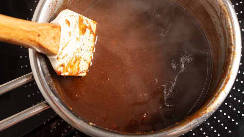 brown sauce in metal pot