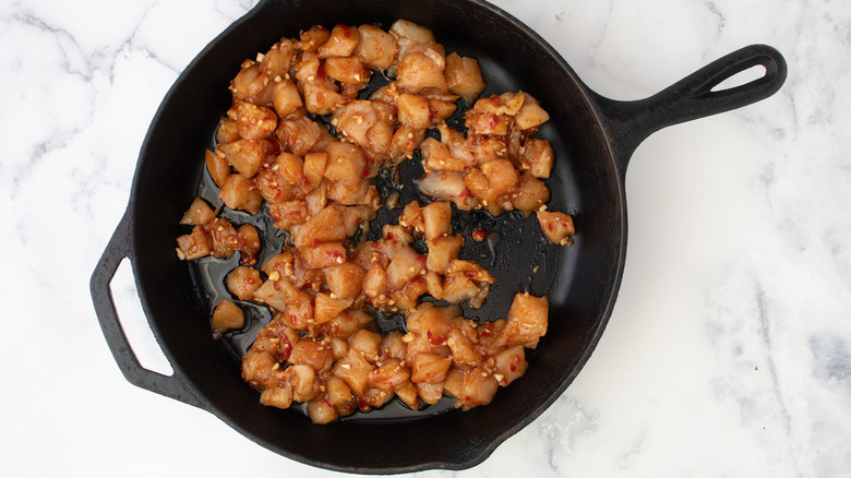 marinated chicken in skillet