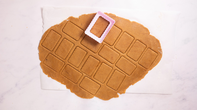 cookie dough with rectangular cookies cut out