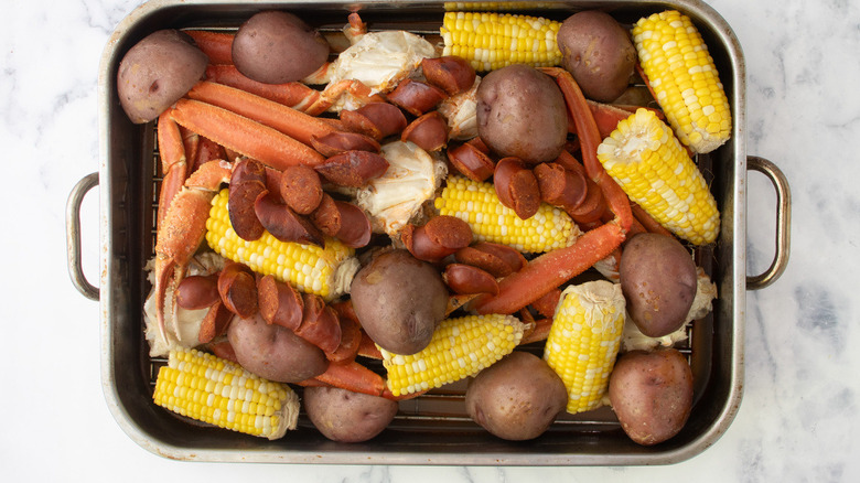 crab legs, potatoes, sausage, corn