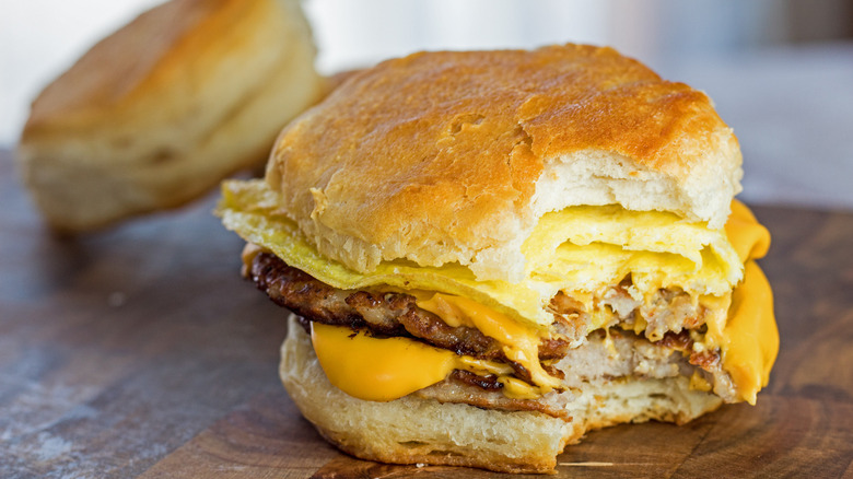 A breakfast sandwich with a bite taken