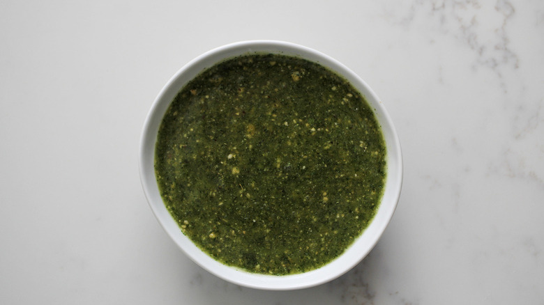 green sauce in white bowl