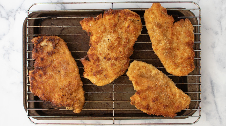 cooked chicken cutlet on rack