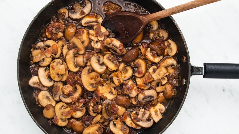 cooking mushrooms in pan