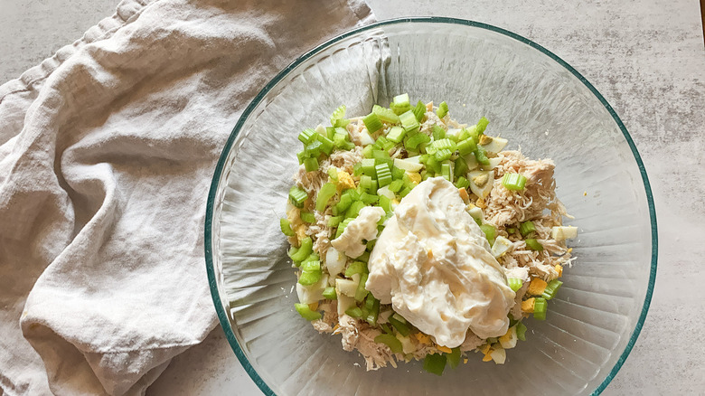 The ingredients for the chicken salad in a bowl