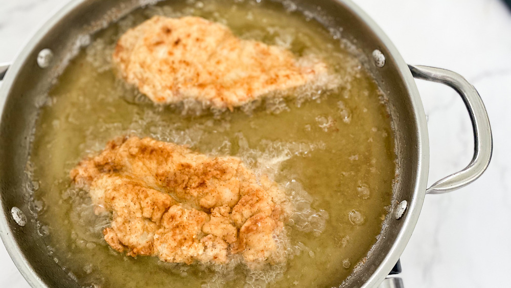 chicken frying in oil