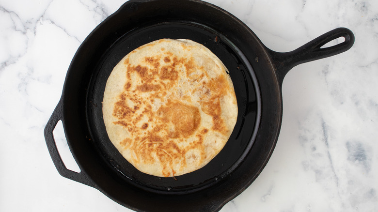 toasted quesadilla in skillet