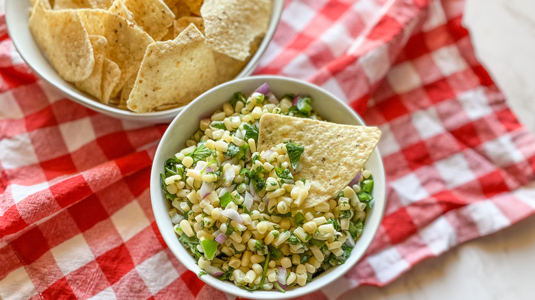 corn salsa in bowl with tortilla chips