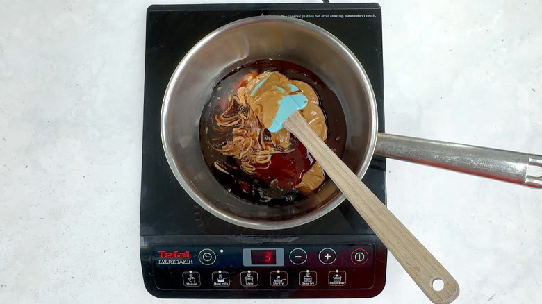 peanut butter, brown rice syrup, and coconut oil in pan