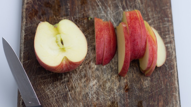 sliced apple on cutting board