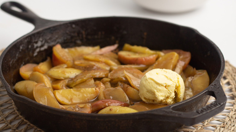 fried apples in pan with ice cream