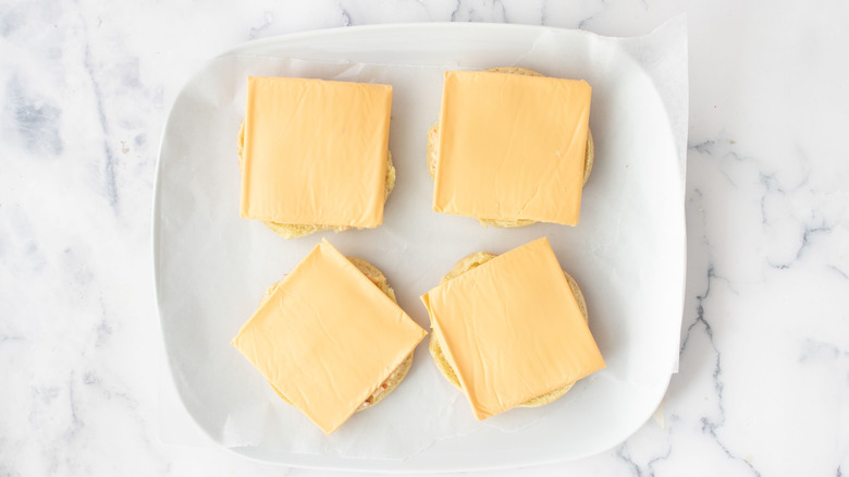 Cheese slices on hamburger buns