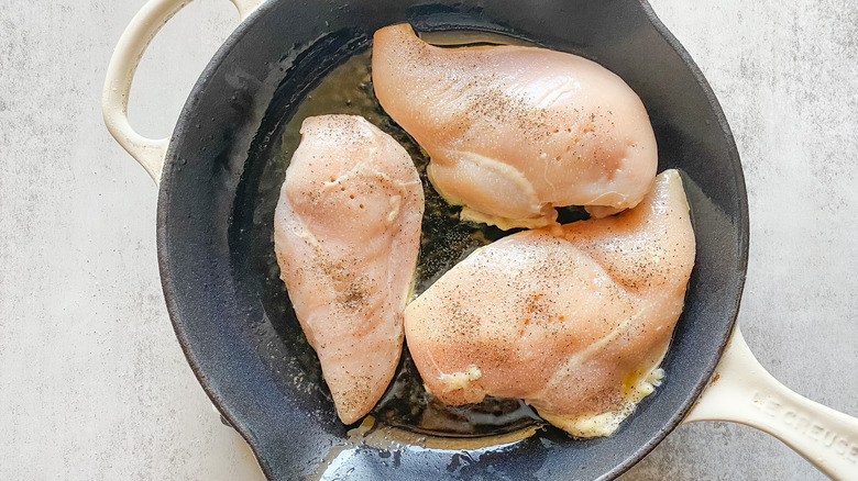 Chicken cooking in skillet