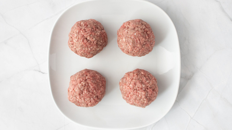 4 ground beef balls on plate