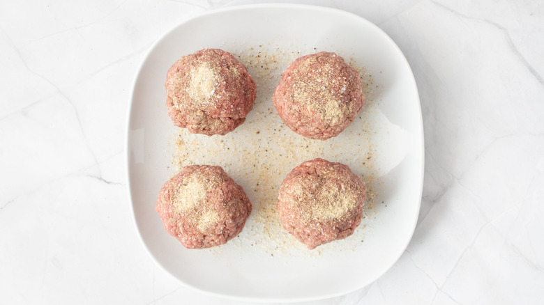 Ground beef balls with seasoning on top