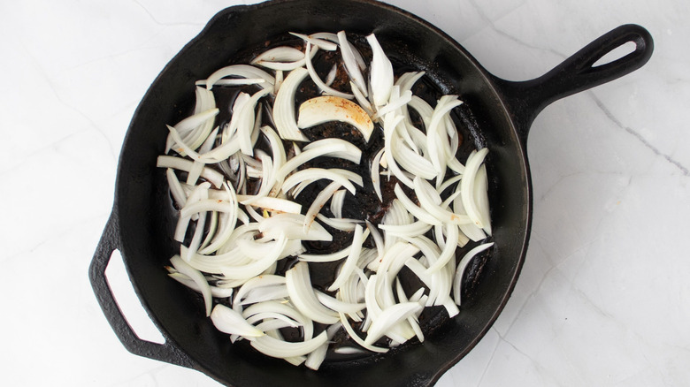 Sliced onions in skillet