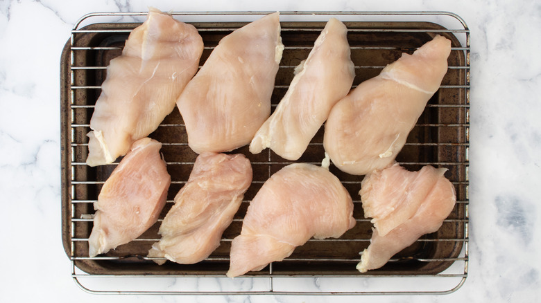 chicken breasts drying on rack