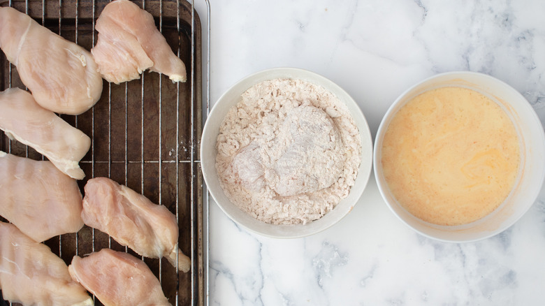 coating chicken breast in breading