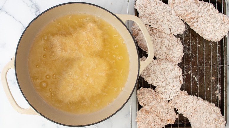 frying breaded chicken in batches