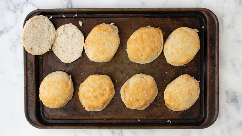 halved biscuits on tray