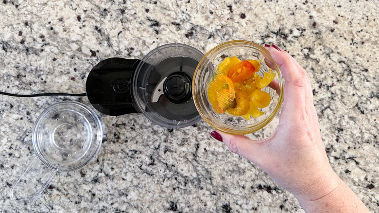 adding peppers to food processor
