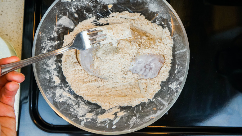 dredge chicken in flour