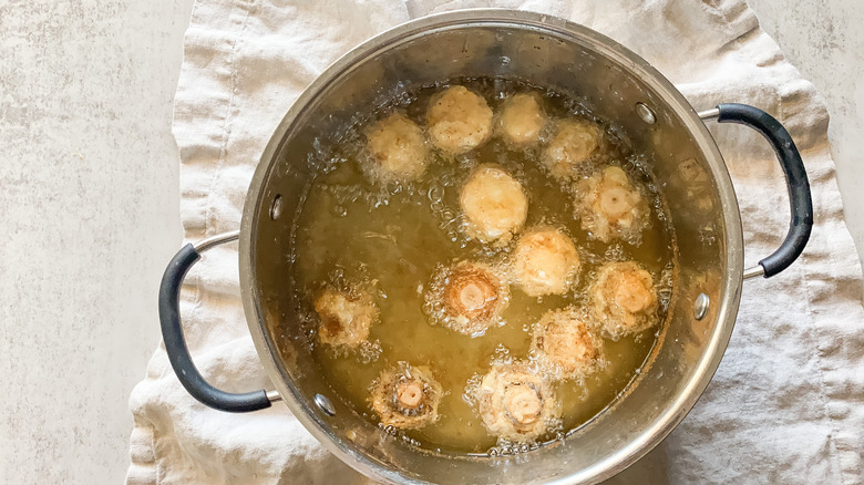 Mushrooms frying in oil