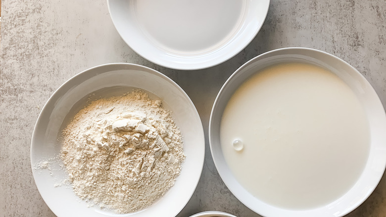 Bowls with breading ingredients