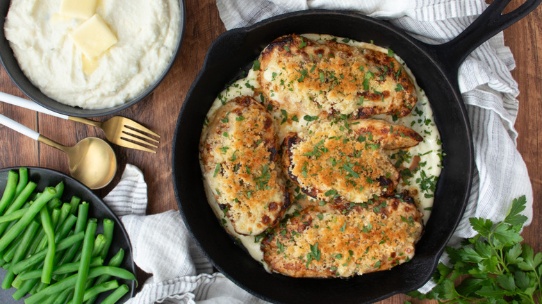 Chicken with herbs in cast iron skillet